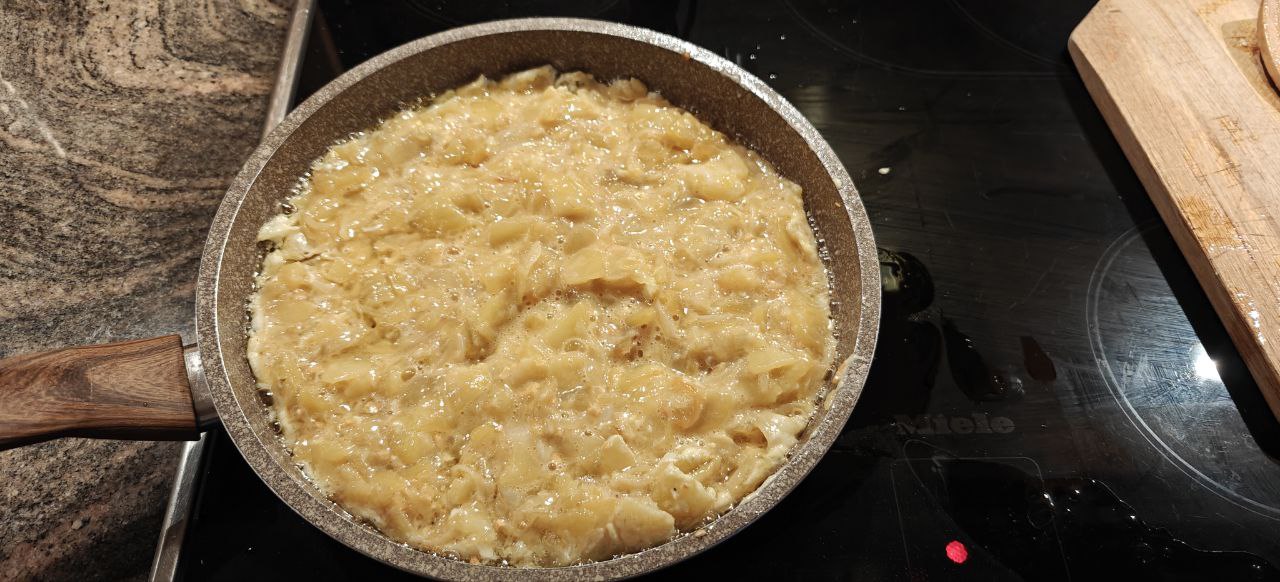 bringing the mass into the pan